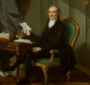 Thomas Paine in green chair